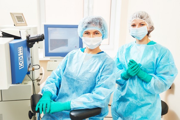 Female surgeon and assistant nurse portraits in uniform in eye v