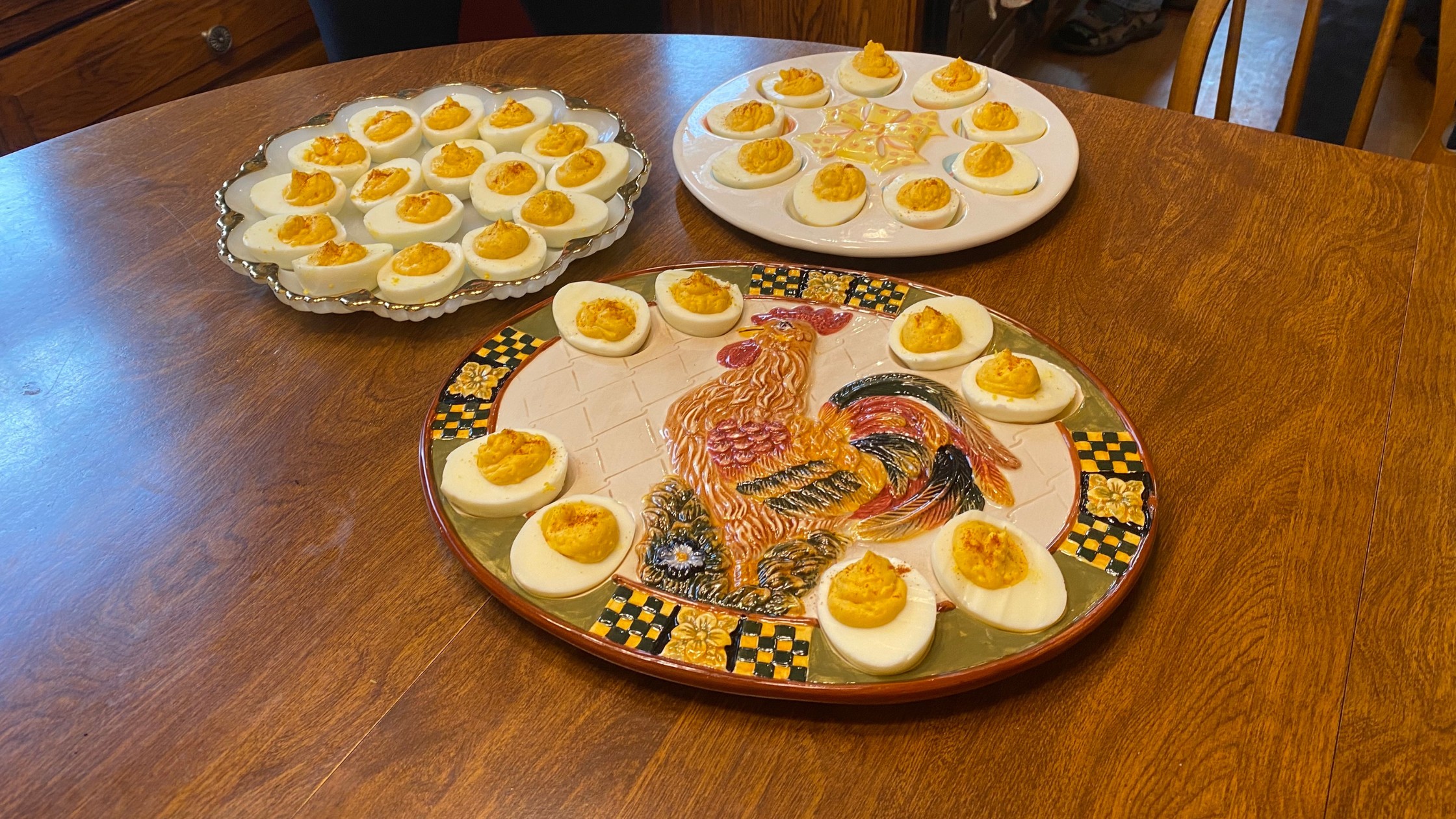 three platters of deviled eggs