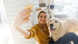veterinarian taking selfie with labrador dog