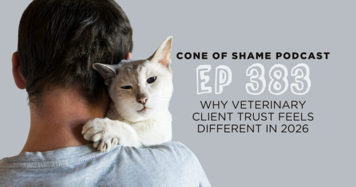 white cat being held over shoulder by owner