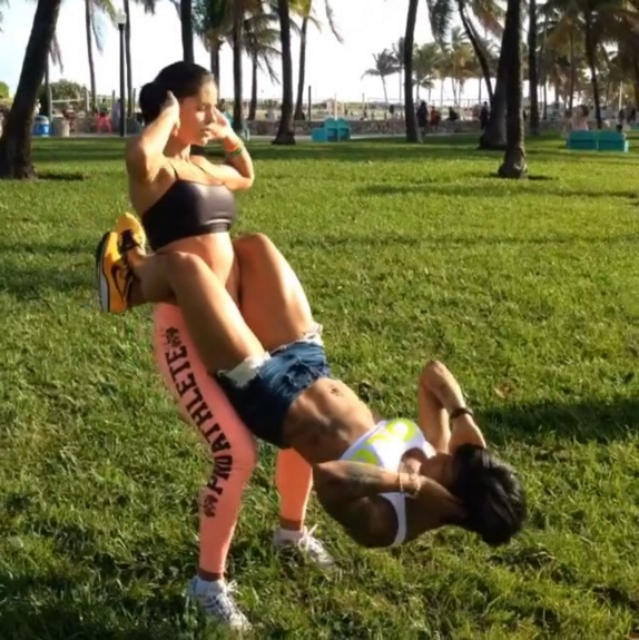 Fitness Influencer example number 2. Double Dare partner crunches.